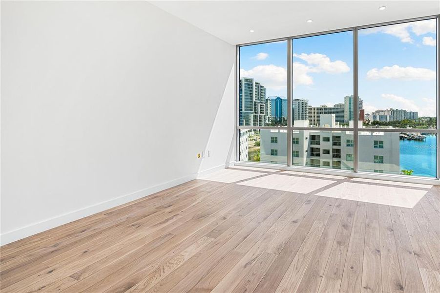 Primary bedroom with water views.