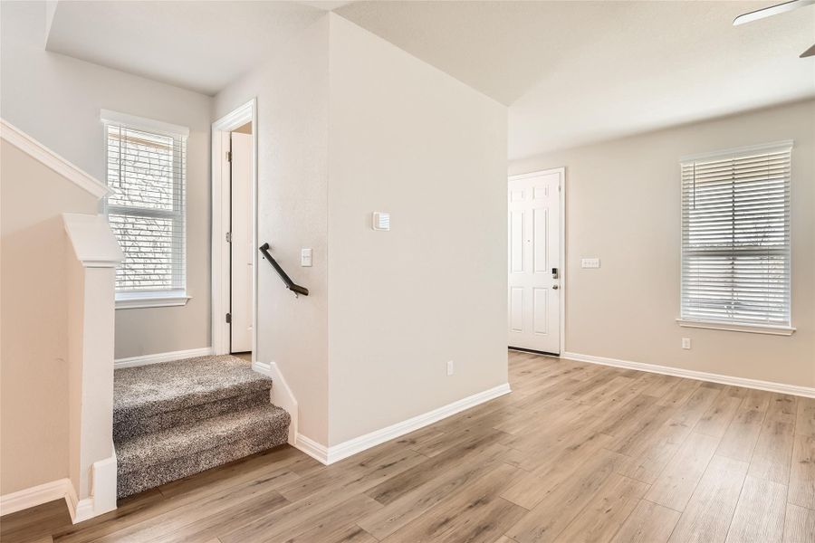 There's also a convenient main floor guest powder room at the base of the stairs.