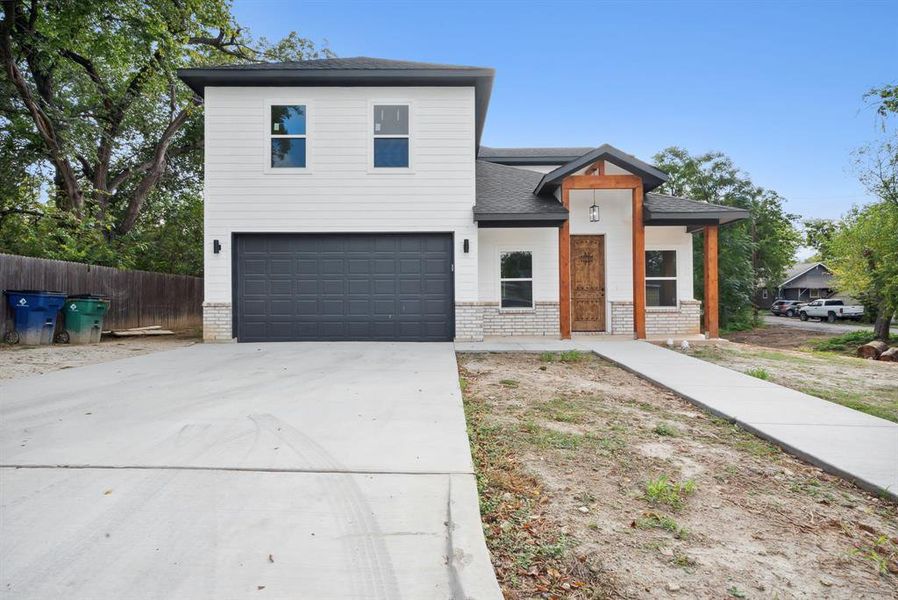 View of front of property with a garage