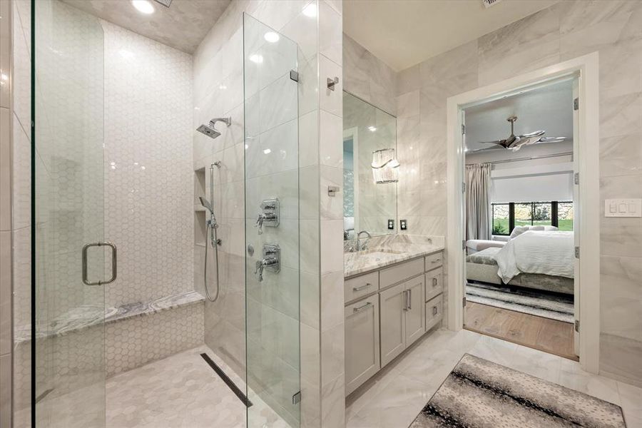 Bathroom featuring vanity, ceiling fan, hardwood / wood-style floors, and walk in shower