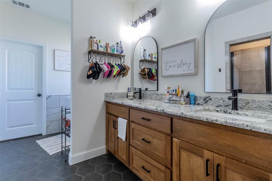 Bathroom with vanity and tile patterned flooring