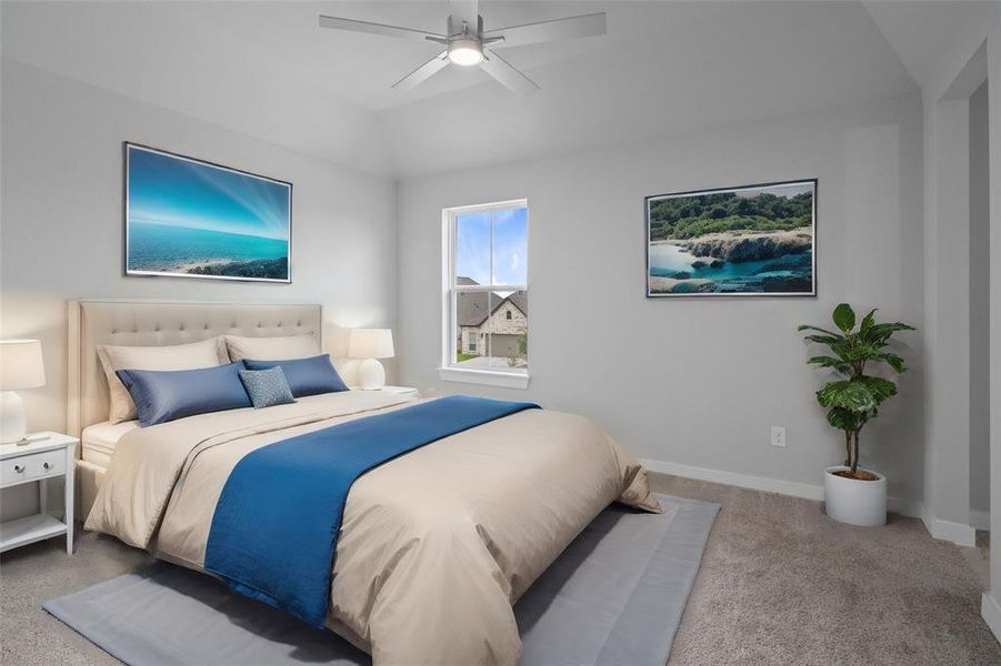 Secondary bedroom features plush carpet, custom paint, light stained ceiling fan with lighting, plenty of windows allowing plenty of natural lighting, and access to the Jack and Jill bath.
