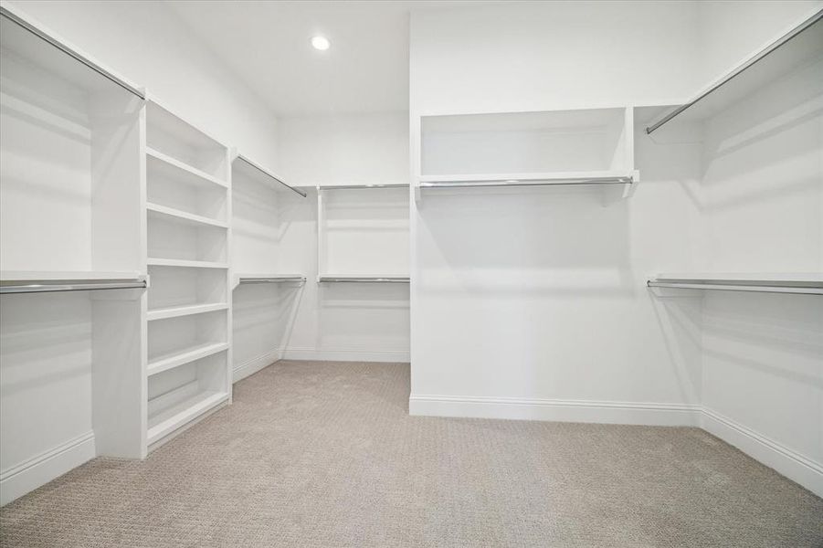 AMAZING CUSTOM Primary Closet with so many built-ins.