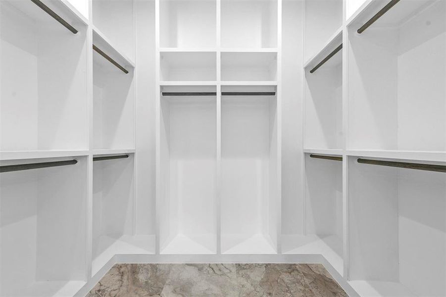 Walk in closet with tile patterned flooring