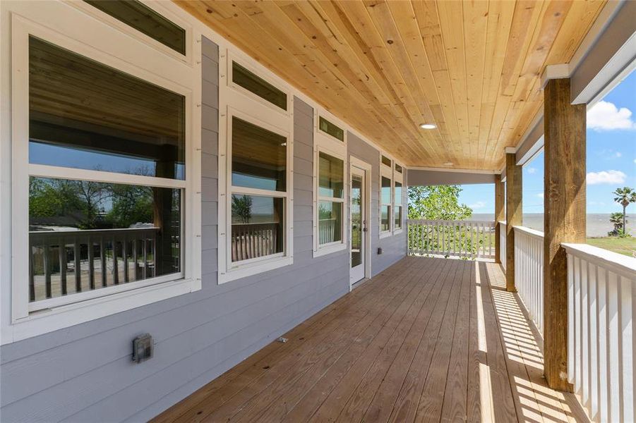 Covered front porch with recessed lighting and outlets. Window are hurricane equipped for shutters.