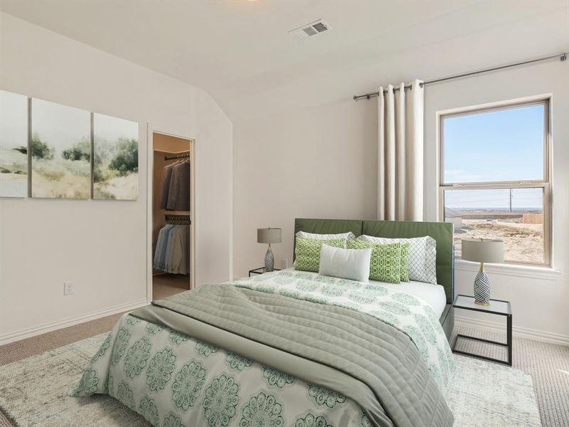 Virtually staged photo - Bedroom with a closet, multiple windows, a spacious closet, and carpet floors