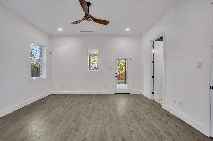 Empty room featuring ceiling fan and light wood-type flooring