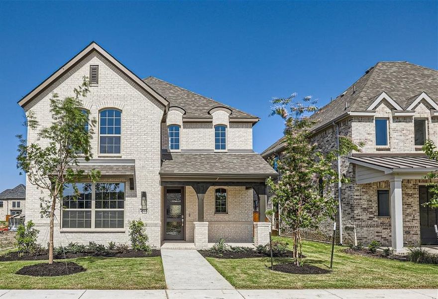 French country style house with a front lawn