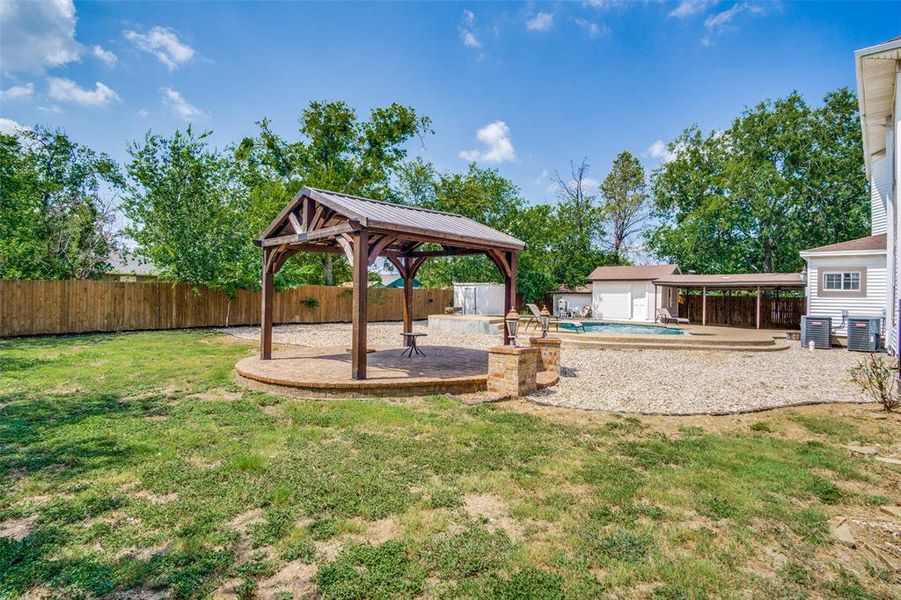 View of yard with a patio area, a gazebo, and a fenced in pool