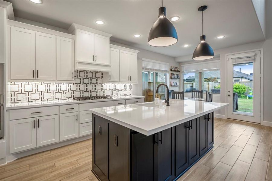 This kitchen will not disappoint! There is plenty of storage and counterspace making this kitchen every chef's dream! It opens to the family room and breakfast nook making it perfect to host any event or holiday!