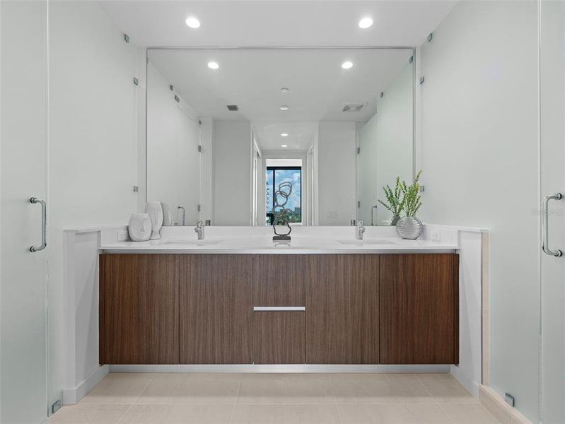 En Suite Bathroom with granite counter tops and  dual sinks