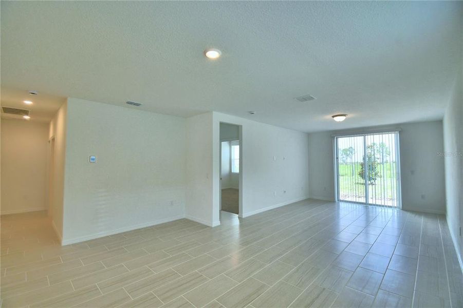 looking out from dining area into great room and into owner's suite