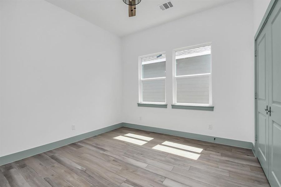 Bedroom number 2 with ceiling fan and tile flooring. No carpet here!