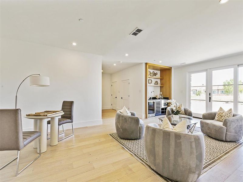 Living room with light hardwood / wood-style flooring