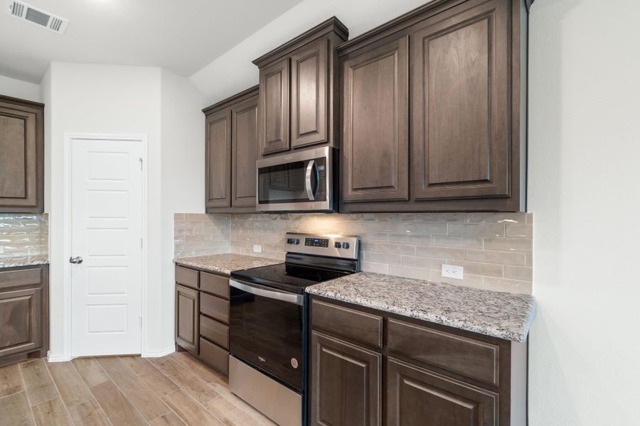 Kitchen | Concept 1660 at Hunters Ridge in Crowley, TX by Landsea Homes