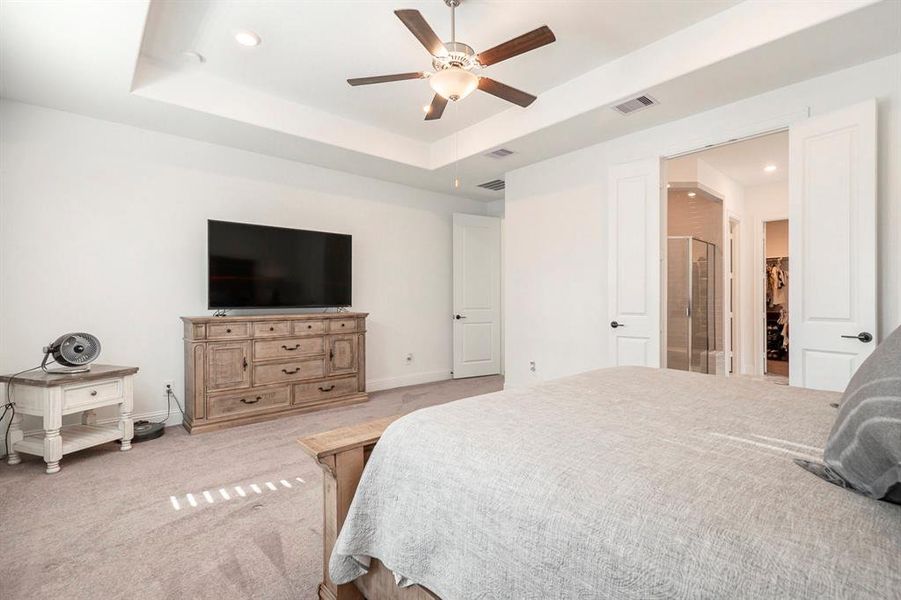 Primary Bedroom with ensuite bath with tray ceiling