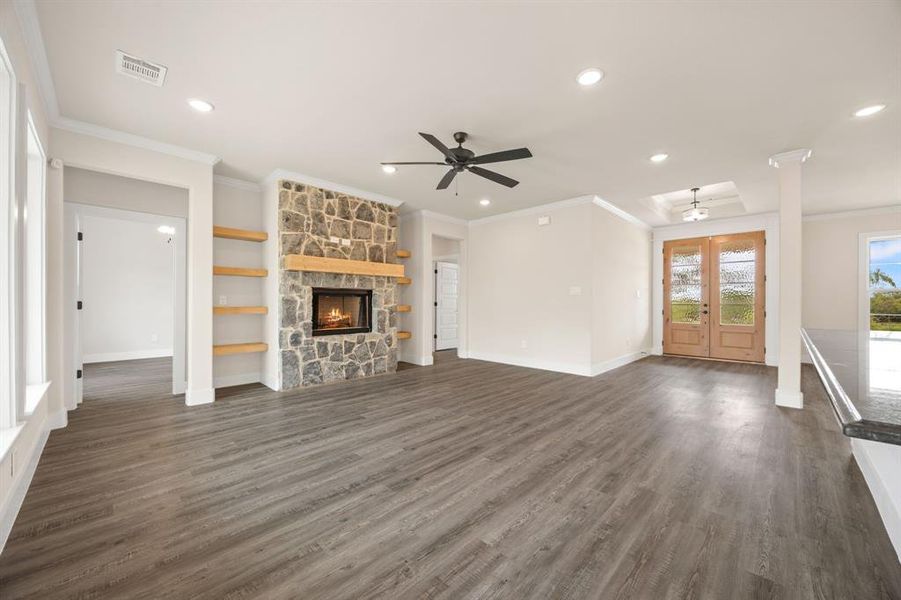 living room with a fireplace looking towards front door