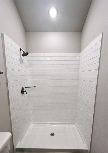 Oversized master shower with ceramic tile walls