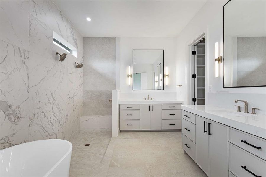 Bathroom with vanity and shower with separate bathtub