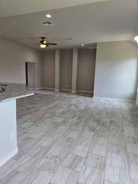 Tiled spare room with ceiling fan