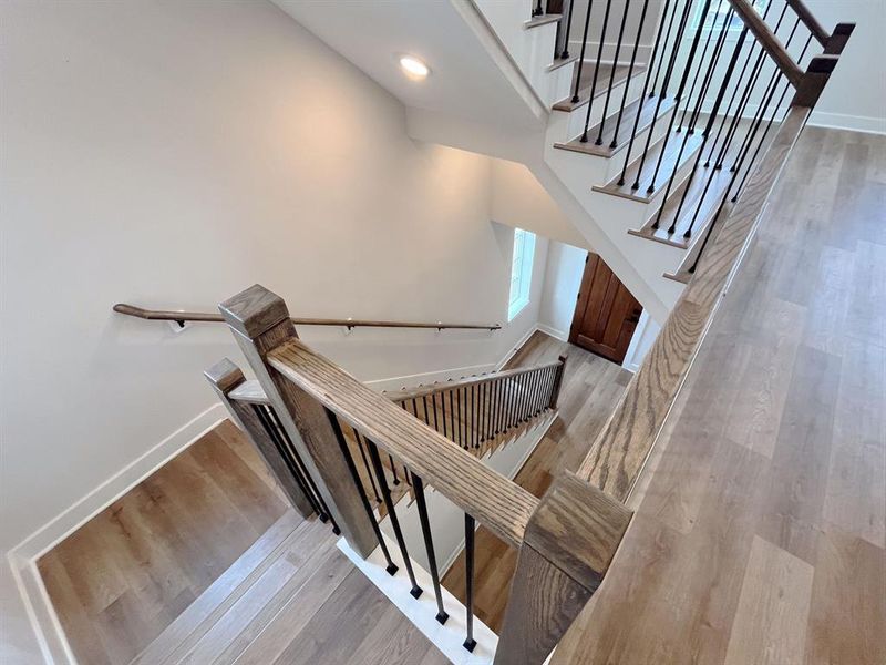 Dramatic open-concept staircase with expansive sightlines.