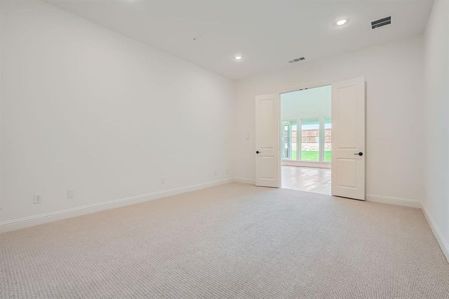 View of carpeted spare room