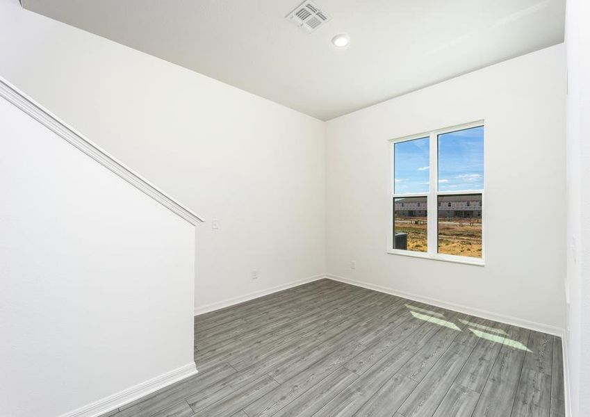 The dining room has a large window with plenty of natural light