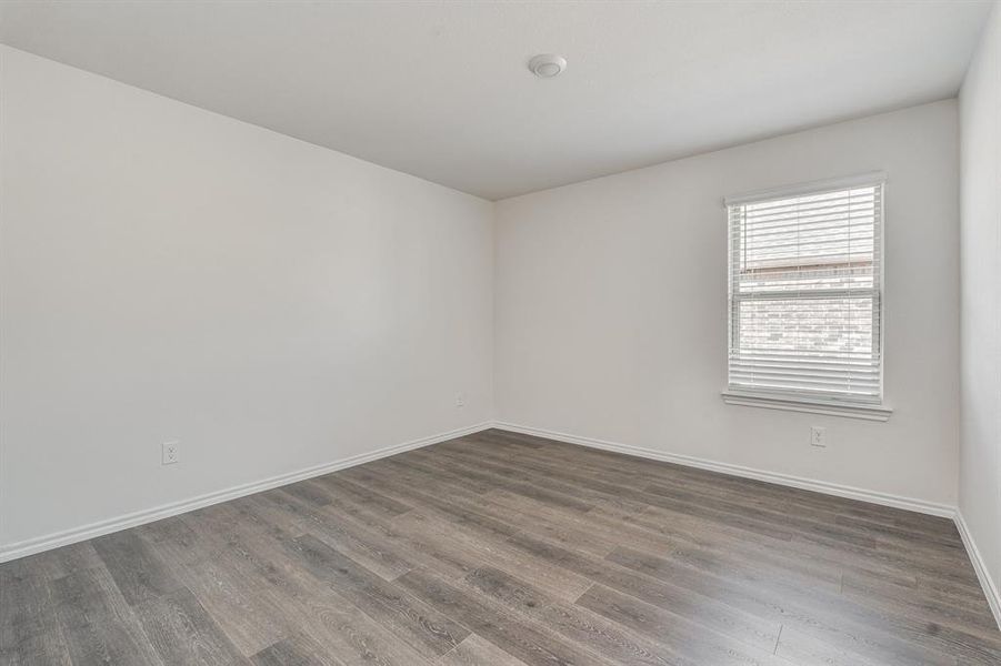 Unfurnished room with dark hardwood / wood-style flooring