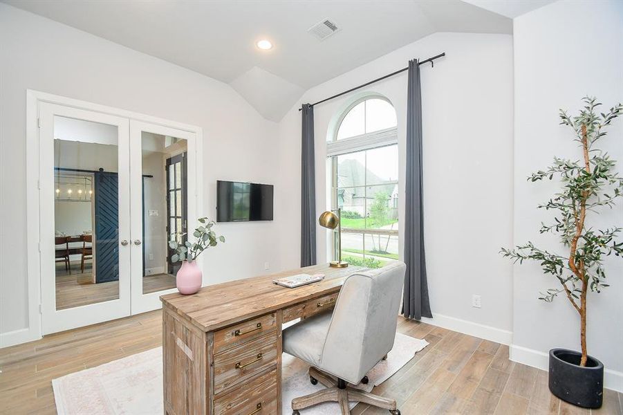 View from office into the entryway. Double French doors for privacy.