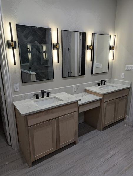 Bathroom with vanity and hardwood / wood-style floors