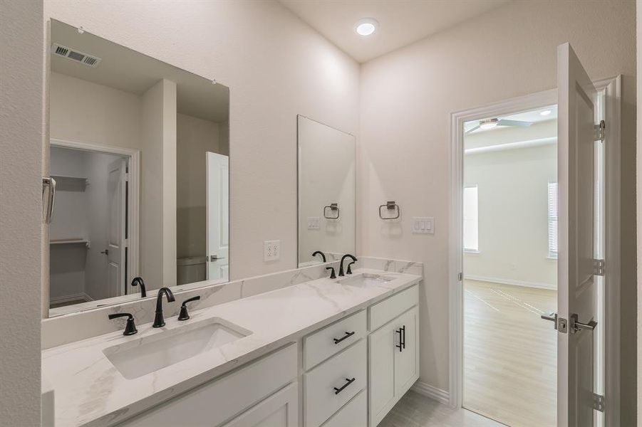 Bathroom with hardwood / wood-style floors and vanity