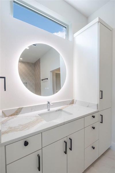 Bathroom with tile floors and vanity