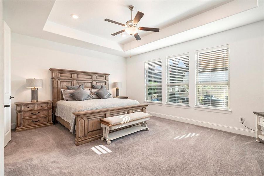 Primary Bedroom with ensuite bath with tray ceiling