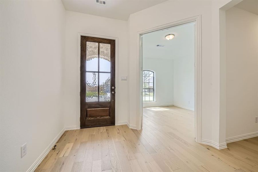 Foyer featuring light hardwood / wood-style flooring