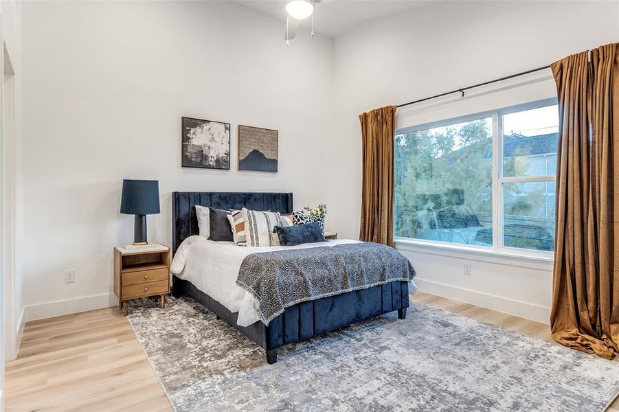 Bedroom with hardwood / wood-style flooring