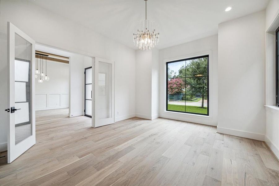 Study view toward foyer and formal dining.