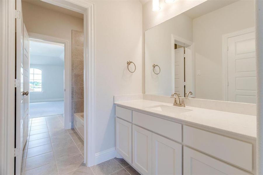 Bathroom with vanity and tile patterned floors