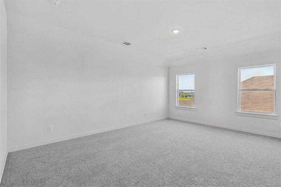 Unfurnished room featuring carpet