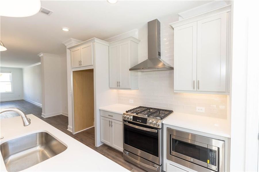 Stainless steel appliances.**Photos of model house and not of actual home - Photos for representation purposes only **