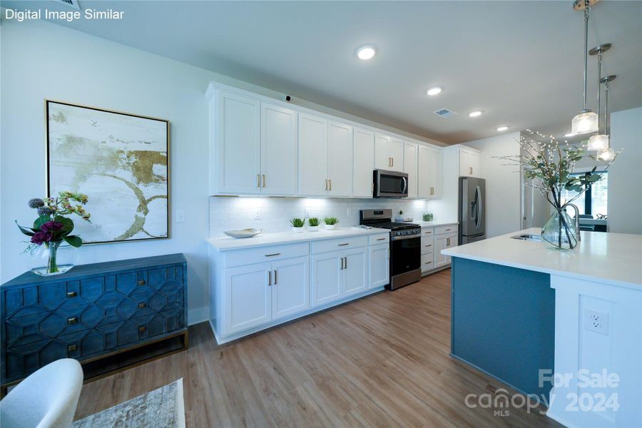 Digital Image Similar: Kitchen features upgraded cabinets with under cabinet lighting