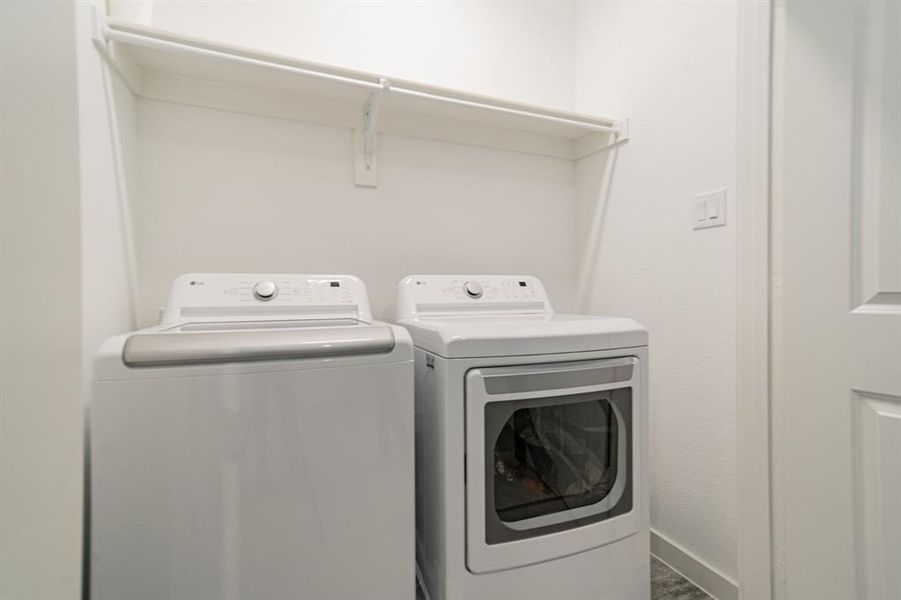 Laundry area with washer and clothes dryer
