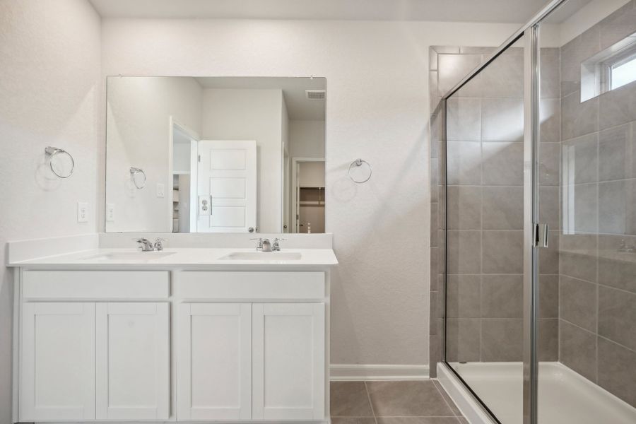 Primary suite bathroom in the Allen floorplan at a Meritage Homes community.