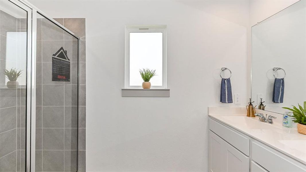 This Primary Suite was made for two! Sleek Chic Bathroom Hardware throughout this amazing New D.R. Horton Home! Comes with Cultured Marble Counters! **Image Representative of Plan Only and May Vary as Built**