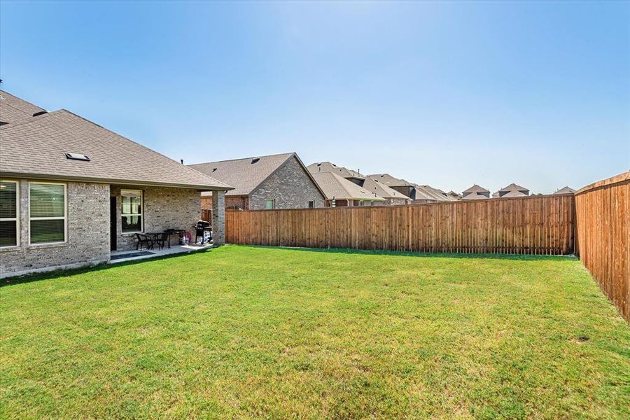 View of yard with a patio area