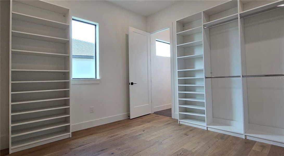 Abundant storage and hanging space in the Primary Suite Closet.