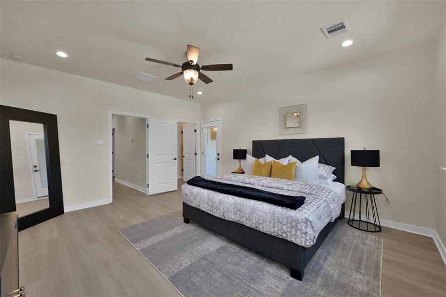 The room is large enough for multiple furniture pieces. The glass door leads to a private balcony.