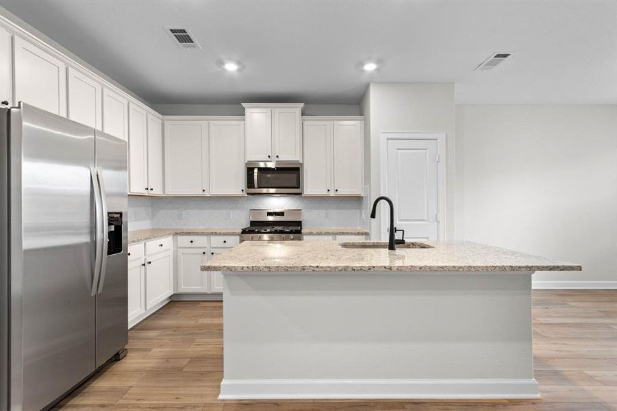 Kitchen with upgraded Whirlpool kitchen appliances.