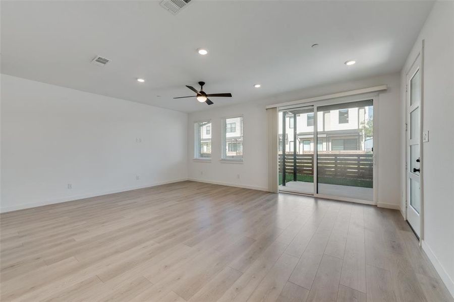 Empty room featuring light hardwood / wood-style floors and ceiling fan