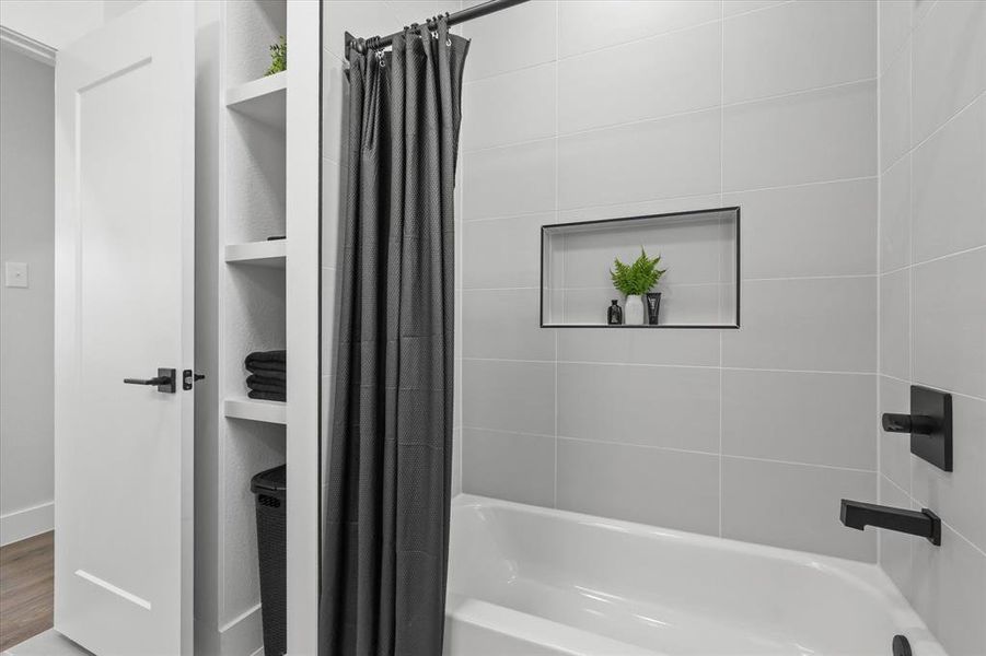 Bathroom Featuring Shelving & Tucked-Away Hamper.