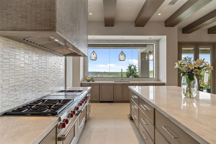Bask in the abundance of natural light that floods the kitchen, creating a bright and airy ambiance that inspires creativity and joy in the culinary process.